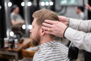 A satisfied client smiling after a haircut