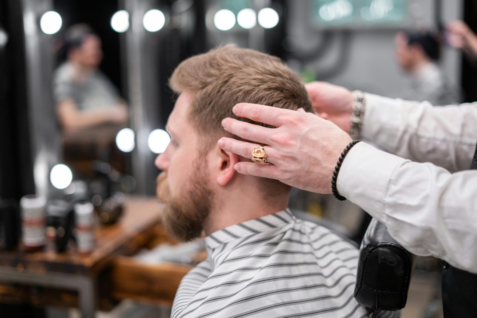 A satisfied client smiling after a haircut